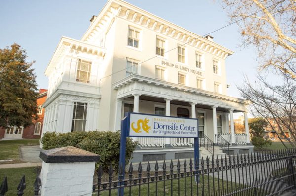 A newly renovated white mansion houses most of the offices for Drexel University's Dornslife Center for Neighborhood Partnerships.